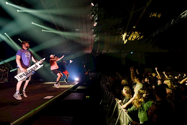 Singer performing live on stage in Bern – powerful concert moment captured by a concert photographer in Bern